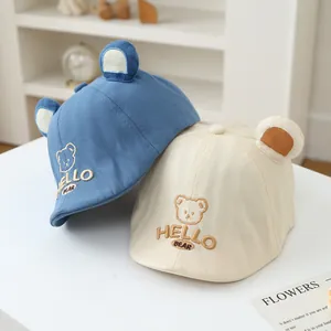 Detail of baby baseball cap with 3D bear ears and HELLO BEAR embroidery craft