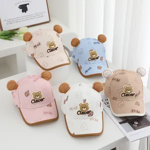 Detailed collection of five pastel children baseball caps with bear ears and bear motifs
