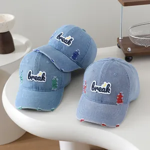 Close-up of children's washed denim baseball cap with break embroidery and color stitching