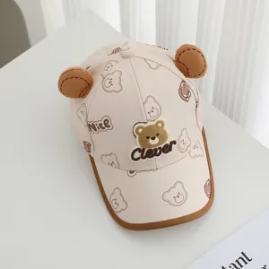 Detail of baby baseball cap featuring 3D bear ears and Clever embroidery on pink fabric
