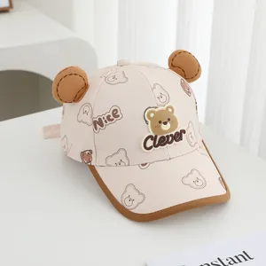 Detail view of pink kids baseball cap with 3D ears and cute cartoon bear prints