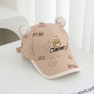Detail of baby bear baseball cap showing 3D ears and cute teddy bear logo patches