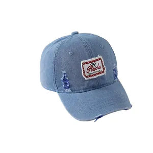 Distressed light blue denim baseball cap for kids with vintage patches and torn details