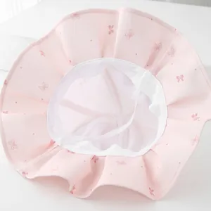 Pink girls sun hat with bow pattern, mesh lining and chin strap for toddler protection