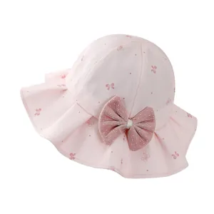 Pink girls sun hat with ruffle brim and mesh bow decoration for summer sun protection
