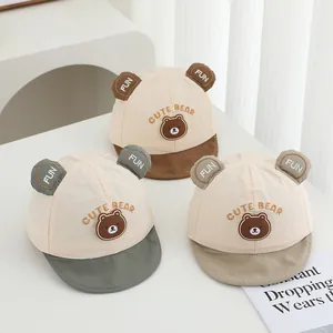 Close-up of soft baby baseball caps featuring cute 3D bear ears and animal embroidery