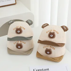Detail of four baby baseball caps with 3D bear ears and cute bear embroidery accents
