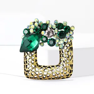 Luxurious vintage square hollow brooch with green crystals and gold metal base