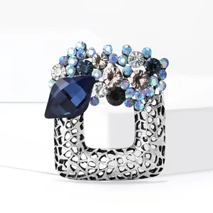 Vintage luxury square wreath brooch with blue crystals and geometric hollow design