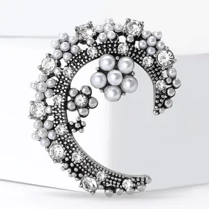 Vintage crescent moon brooch with pearls and rhinestones in silver finish