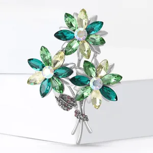 Elegant bouquet brooch with marquise crystal petals and rhinestone ribbon in silver finish