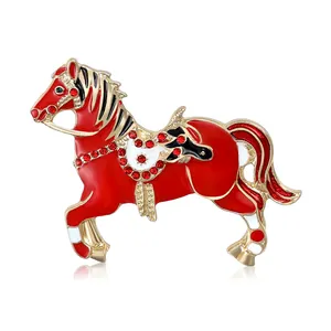 Exquisite carousel horse brooch with red enamel, gold accents and sparkling crystals