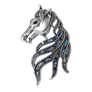 Vintage horse head brooch in silver tone with colorful rhinestones and hollow mane design