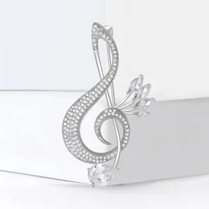 Silver treble clef music note brooch with sparkling marquise and pear-cut cubic zirconia