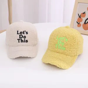 Kids warm fleece baseball caps in cream and yellow with Let's Do This embroidery