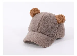 Detailed texture of brown plush baseball cap featuring cute 3D bear ears on top