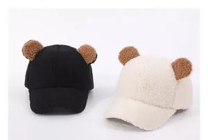 Detail of plush bear ears on soft faux fur winter baseball caps for babies and kids