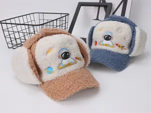 Detailed view of kids' winter fleece trapper hats featuring cartoon astronaut embroidery