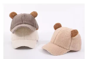 Detail view of plush teddy fleece baseball hats with cute bear ears in three soft colors
