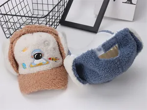 Detail view of winter trapper hats for kids with astronaut embroidery and plush lining
