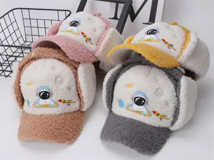 Close-up of four sherpa pilot hats for kids featuring astronaut and rocket embroidery