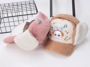 Detailed macro view of plush lamb wool earflap hats with cute bunny embroidery for kids