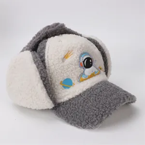 Detailed close-up of thick sherpa fleece texture and embroidered astronaut patch