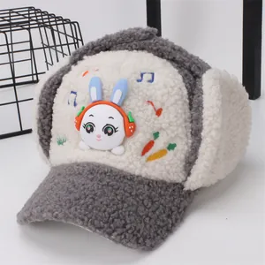 Detailed view of children's grey plush trapper hat with 3D bunny and warm ear flaps