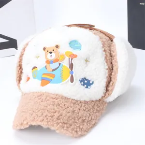 Winter fleece-lined kids earflap hat with cartoon bear embroidery for outdoor wind protection