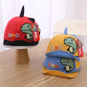 Cartoon dinosaur baby baseball caps with soft brims in red, yellow and blue colors