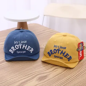 Toddler cotton baseball cap with soft brim in navy and yellow featuring brother embroidery