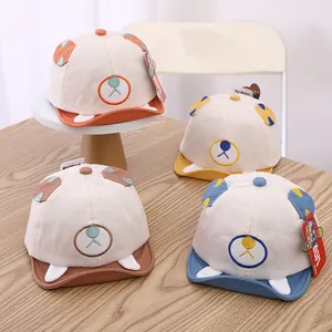 Detailed set of cartoon bear baby baseball caps in orange, yellow, brown and blue colors