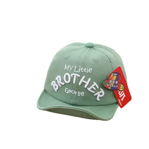 Light green cotton soft brim baby baseball cap with George embroidery on white background