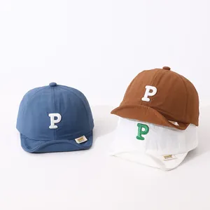 Detailed close-up of quick-dry cotton baby baseball caps with embroidered P letter