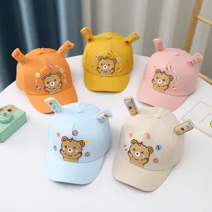 Detail of baby baseball caps with cartoon bear embroidery and 3D decorative ears