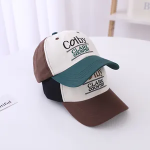 Detailed embroidery of Colby and Clark Country on two-tone vintage kids baseball caps