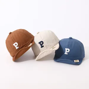 Detailed set of three cotton baseball caps for kids in brown, beige, and blue with P patch