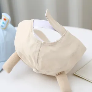 Detail of adjustable velcro closure on beige cartoon baby baseball cap with soft horns