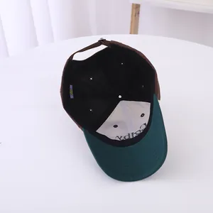 Detail view showing internal stitchwork and adjustable strap of the tricolor baseball cap