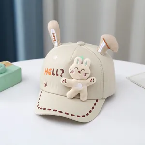 Detail of baby bunny baseball cap with 3D ears, plush rabbit, and star patterns