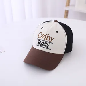 Detail shot of Colby Clark Country embroidered letters on a tri-color cotton baseball cap