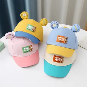 Cute baby baseball caps with 3D ears and small bear dolls in four colorful pastel options