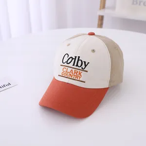 Detail shot of multi-color baseball cap with Colby CLARK COUNTRY embroidery