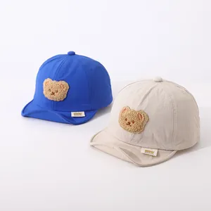 Quick-dry baby baseball caps with soft brim and cartoon bear embroidery in blue and beige