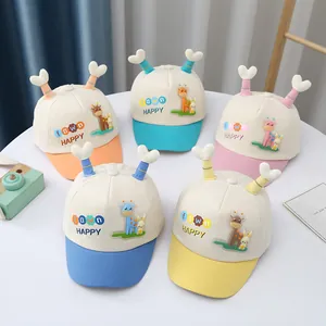 Close-up of colorful cartoon baby baseball caps with 3D horns in five vibrant colors