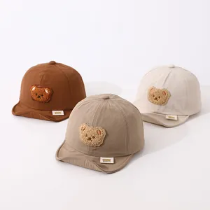 Baby quick-dry baseball caps with cartoon bear in brown, khaki, and cream colors