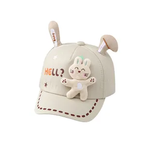 Cute beige baby baseball cap with bunny ears and plush doll for toddlers aged 0-3