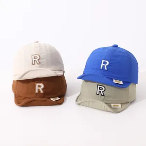 Quick-dry cotton kids soft brim baseball caps with letter R embroidery in four colors