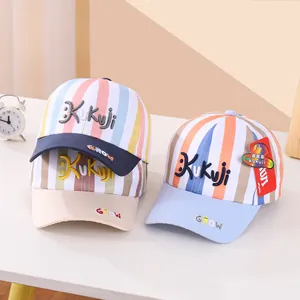 Detail of colorful striped baseball caps for kids with smile face embroidery