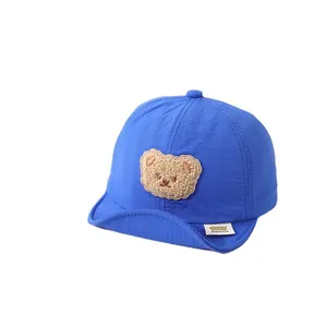 Toddler baseball cap in bright blue with a cute plush bear patch and soft brim